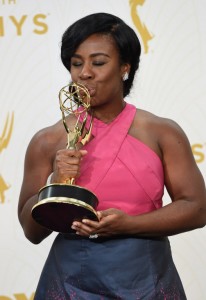 Uzo Aduba poses with her Emmy Award for Outstanding Supporting Actress In A Drama Series for her role in "Orange Is The New Black," in the press room during the 67th Emmy Awards, September 20, 2015 at the Microsoft Theatre in downtown Los Angeles. AFP PHOTO / VALERIE MACON